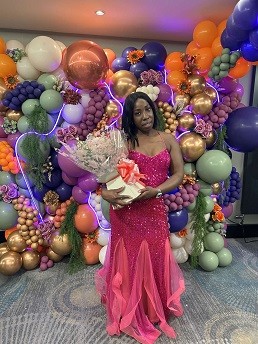 Photo of Davia McKoy, celebrating success as one of the Black Achievers Awards organisers.