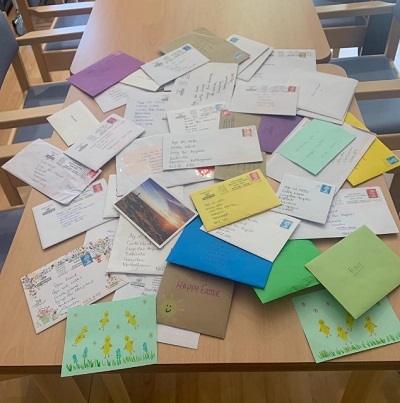 Pile of letters written for the Dear Friend scheme